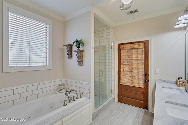 210 Planters Grv, Brandon, MS 39047 - bathroom featuring a sink, a shower stall, a jetted tub, wood finished floors, and crown molding