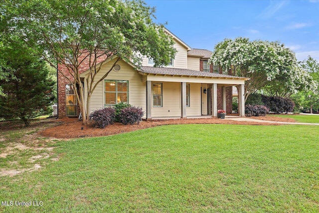 210 Planters Grv, Brandon, MS 39047 - view of front facade with a front yard, a porch, and a shingled roof
