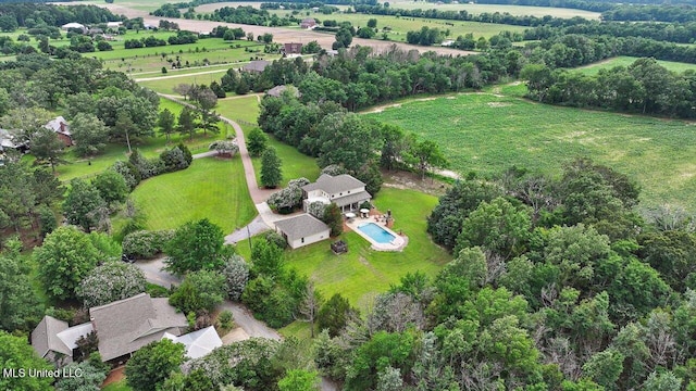 210 Planters Grv, Brandon, MS 39047 - aerial view of property's location with rural landscape, a pool, and a tree filled landscape