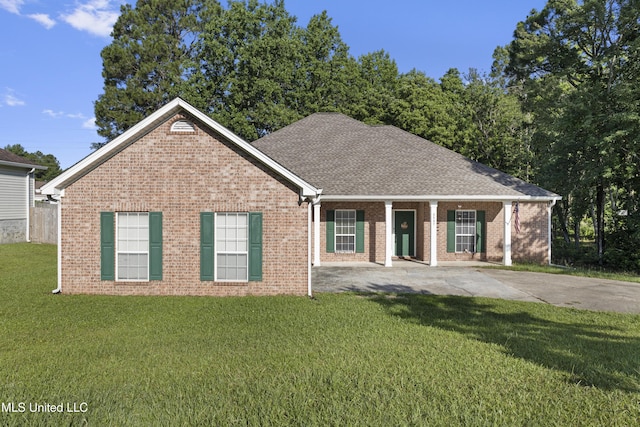 6507 Shoshonee Dr, Ocean Springs, MS 39564 - ranch-style home with brick siding, a front lawn, and a shingled roof