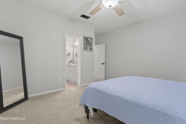 6507 Shoshonee Dr, Ocean Springs, MS 39564 - bedroom with light carpet, a ceiling fan, baseboards, and ensuite bathroom