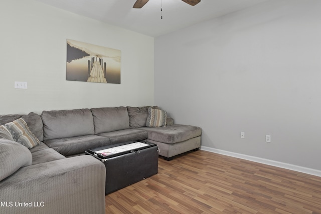 6507 Shoshonee Dr, Ocean Springs, MS 39564 - living room featuring a ceiling fan, wood finished floors, and baseboards