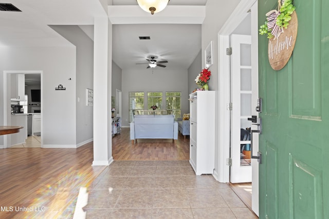 6507 Shoshonee Dr, Ocean Springs, MS 39564 - foyer entrance with ceiling fan, light wood finished floors, and baseboards