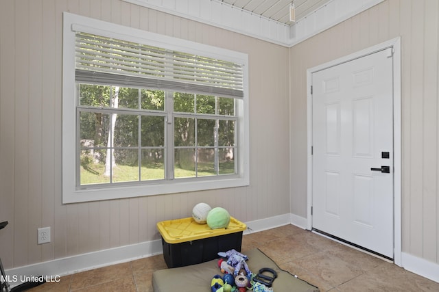 6507 Shoshonee Dr, Ocean Springs, MS 39564 - foyer entrance with baseboards, plenty of natural light, and wooden walls