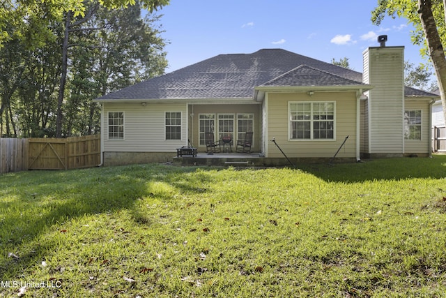 6507 Shoshonee Dr, Ocean Springs, MS 39564 - back of property with a chimney, a patio, a shingled roof, and a gate