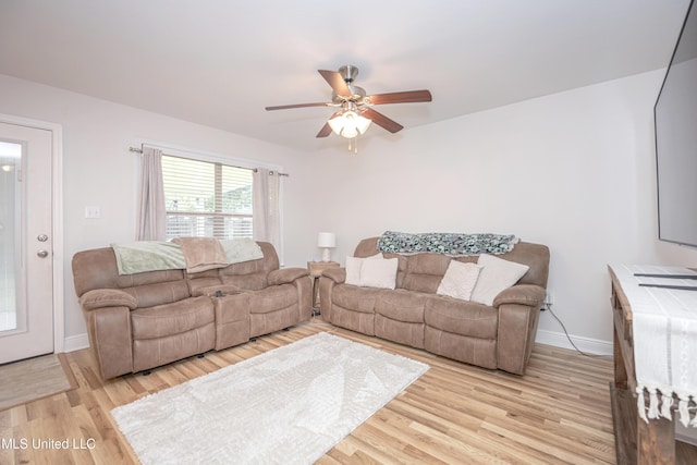 18108 Steamer Way, Gulfport, MS 39503 - living room with a ceiling fan, light wood-style flooring, and baseboards