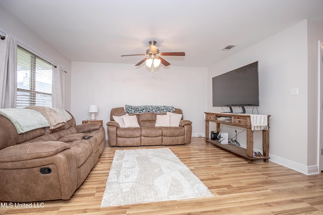 18108 Steamer Way, Gulfport, MS 39503 - living area with ceiling fan, wood finished floors, and baseboards