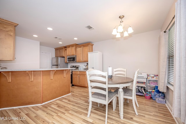 18108 Steamer Way, Gulfport, MS 39503 - dining space featuring a chandelier, light wood finished floors, and recessed lighting