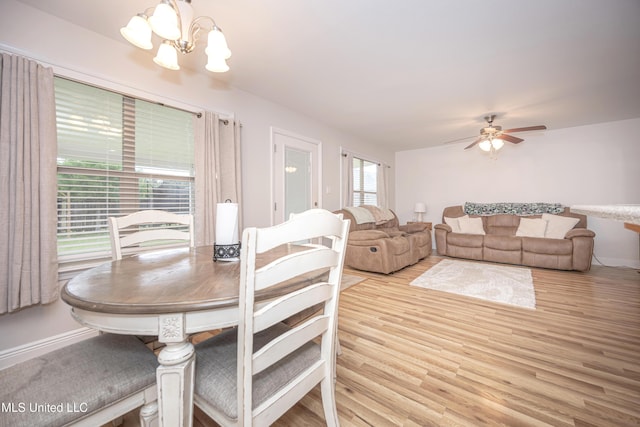 18108 Steamer Way, Gulfport, MS 39503 - dining space featuring a chandelier, light wood-style floors, a ceiling fan, and baseboards