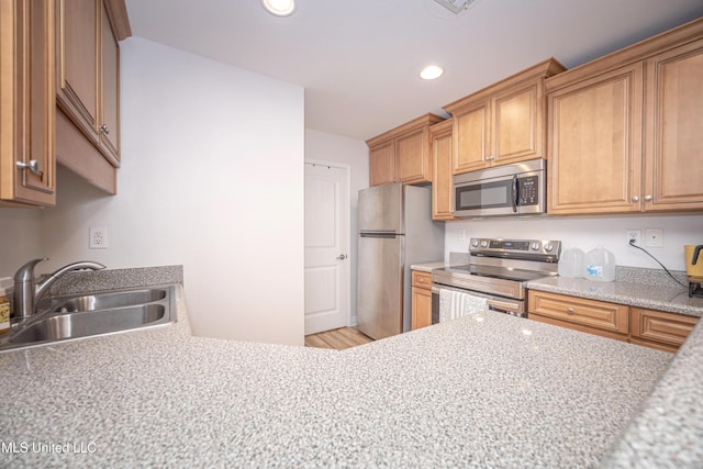 18108 Steamer Way, Gulfport, MS 39503 - kitchen with appliances with stainless steel finishes, a sink, light countertops, recessed lighting, and light wood-type flooring