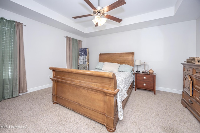 18108 Steamer Way, Gulfport, MS 39503 - bedroom with a raised ceiling, light colored carpet, and baseboards