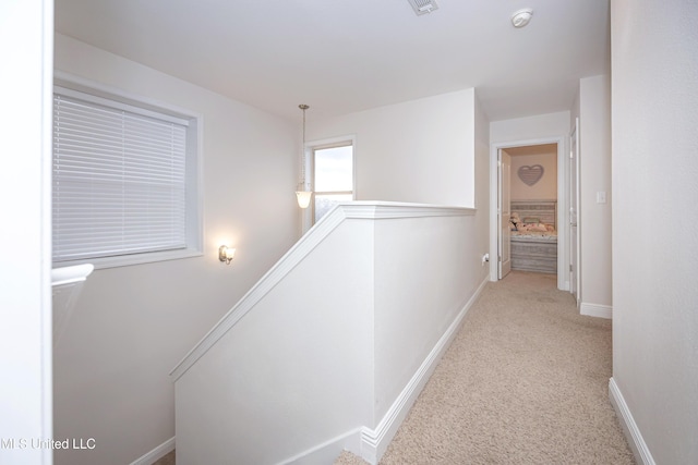 18108 Steamer Way, Gulfport, MS 39503 - hallway featuring an upstairs landing, carpet, and baseboards