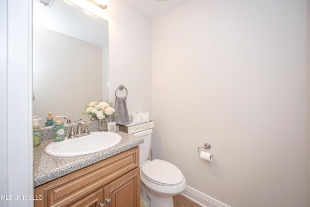 18108 Steamer Way, Gulfport, MS 39503 - bathroom with vanity, toilet, and baseboards