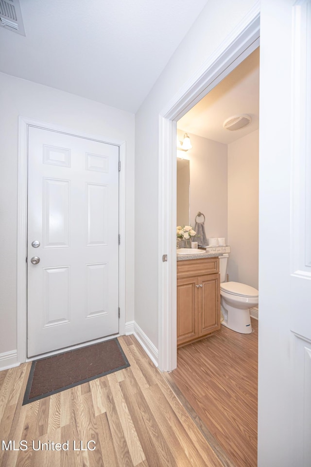 18108 Steamer Way, Gulfport, MS 39503 - foyer entrance featuring light wood-style flooring and baseboards