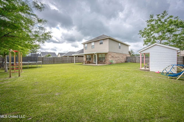 18108 Steamer Way, Gulfport, MS 39503 - view of yard featuring a trampoline and a patio