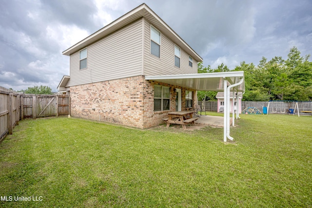 18108 Steamer Way, Gulfport, MS 39503 - back of house with brick siding, a patio, and a gate