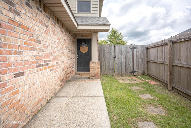 18108 Steamer Way, Gulfport, MS 39503 - entrance to property featuring a shingled roof and brick siding