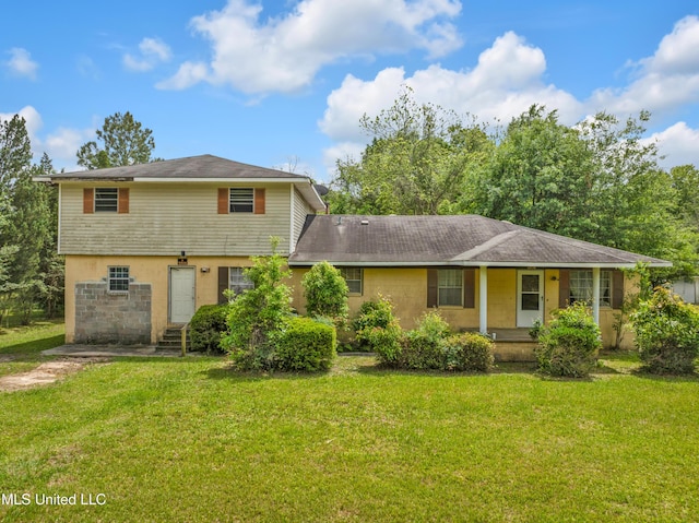 back of property featuring a lawn, entry steps, and a porch