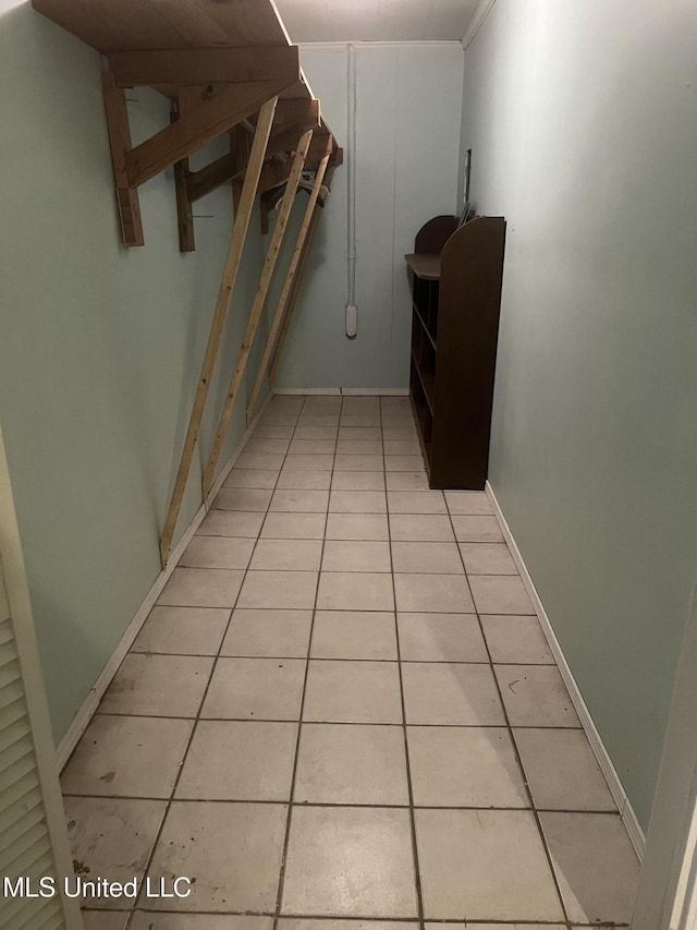 corridor featuring light tile patterned floors