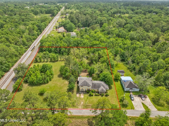 aerial overview of property's location featuring property boundaries highlighted and a forest