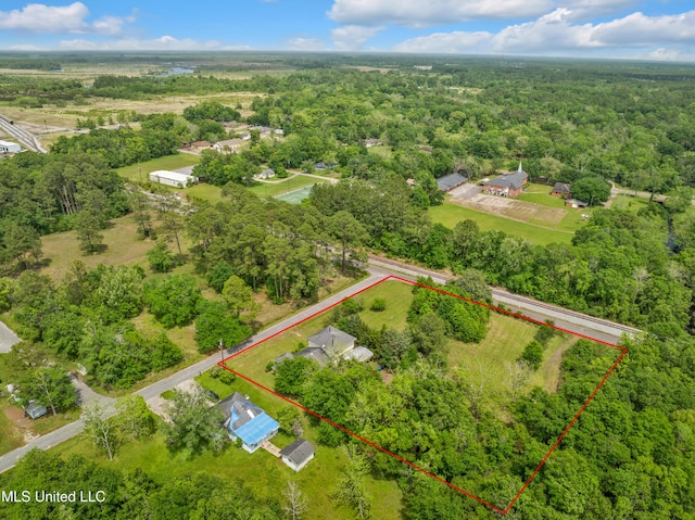 view of property location featuring property parcel outlined and a forest