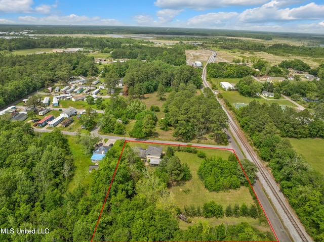 aerial view of property and surrounding area featuring property boundaries highlighted