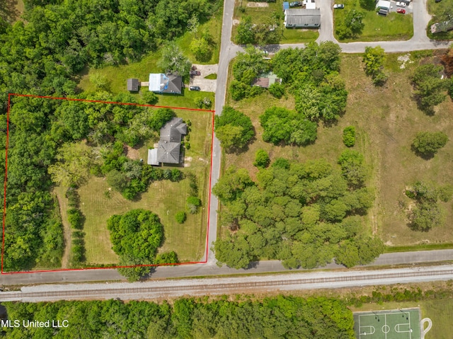 aerial view of property and surrounding area with property parcel outlined