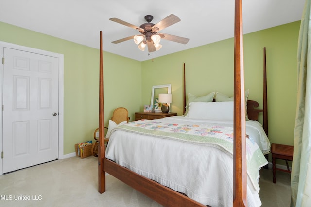 bedroom featuring ceiling fan and light carpet