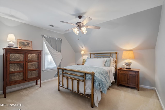 bedroom featuring ceiling fan, lofted ceiling, and light carpet