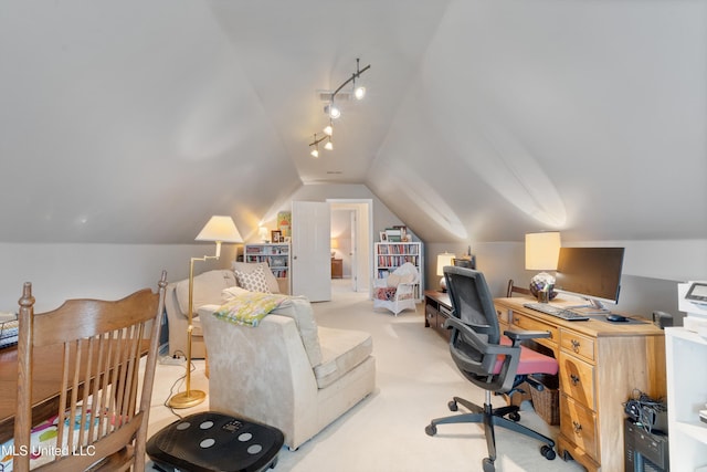 home office featuring light colored carpet and lofted ceiling