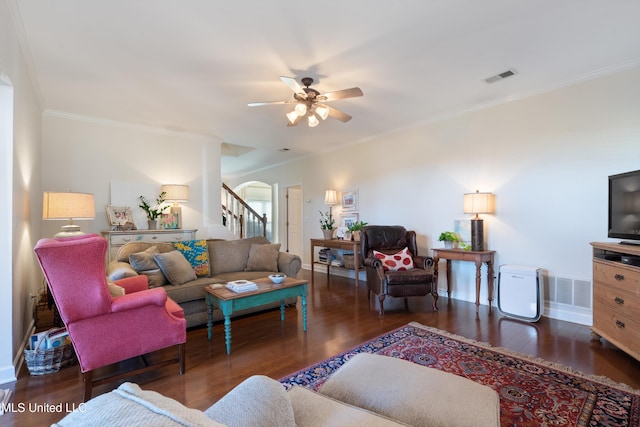 living room featuring crown molding, dark hardwood / wood-style flooring, and ceiling fan