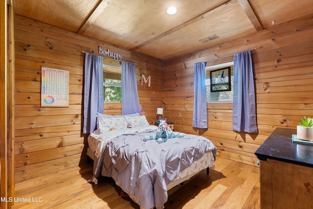 927 Abe Chapel Rd, Como, MS 38619 - bedroom featuring wood walls, wood ceiling, and light wood-type flooring