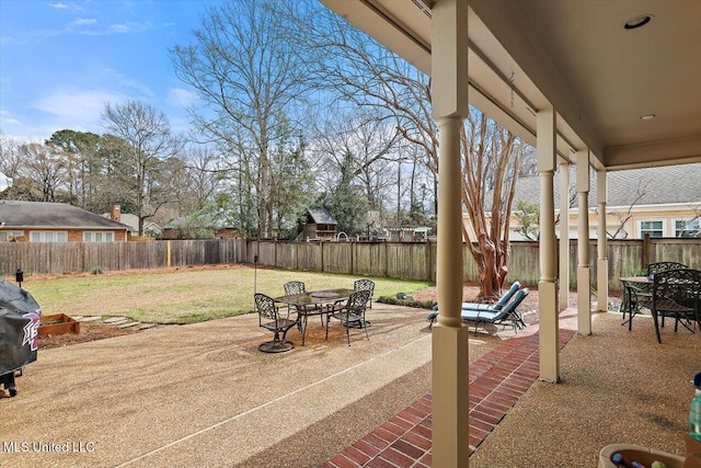 view of patio / terrace with outdoor dining space and a fenced backyard