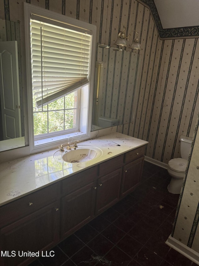 407 N Thunderbird Rd, Hernando, MS 38632 - bathroom featuring wallpapered walls, vanity, and tile patterned flooring