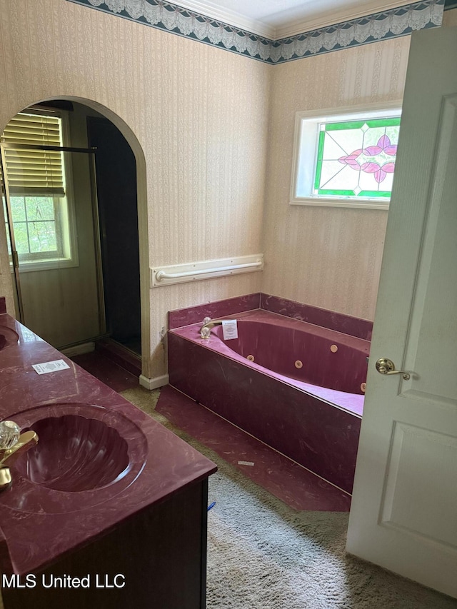 407 N Thunderbird Rd, Hernando, MS 38632 - bathroom with a whirlpool tub, vanity, and wallpapered walls