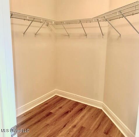 14816 Canal Crossing Blvd, Gulfport, MS 39503 - walk in closet featuring wood finished floors