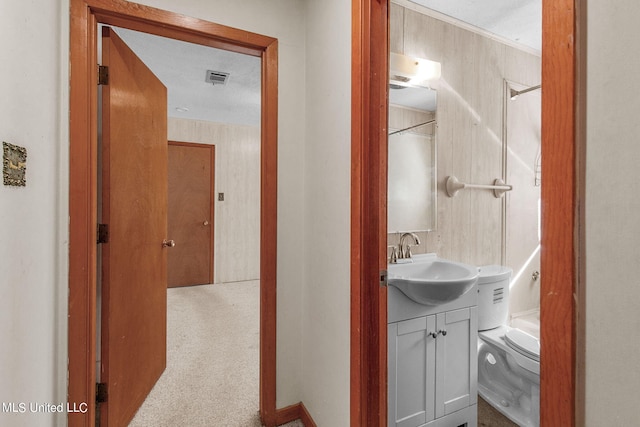 bathroom featuring vanity, toilet, a textured ceiling, and walk in shower