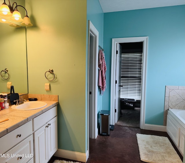 8 Audubon Pl, Natchez, MS 39120 - bathroom with baseboards, a bath, and vanity