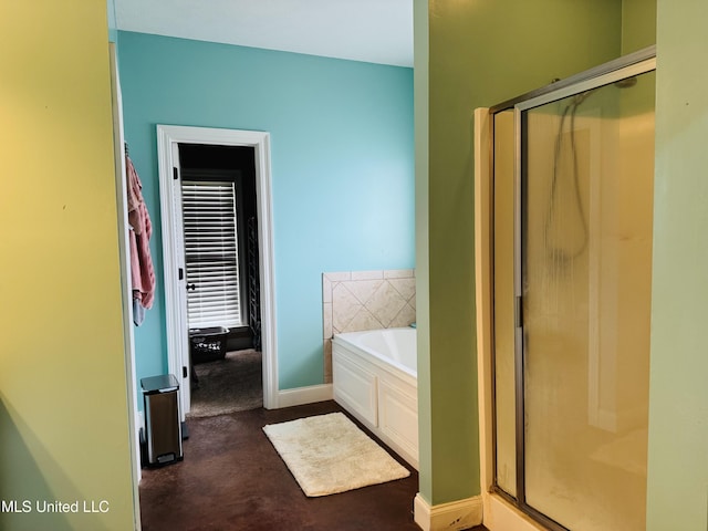 8 Audubon Pl, Natchez, MS 39120 - full bath with a garden tub, a shower stall, and baseboards