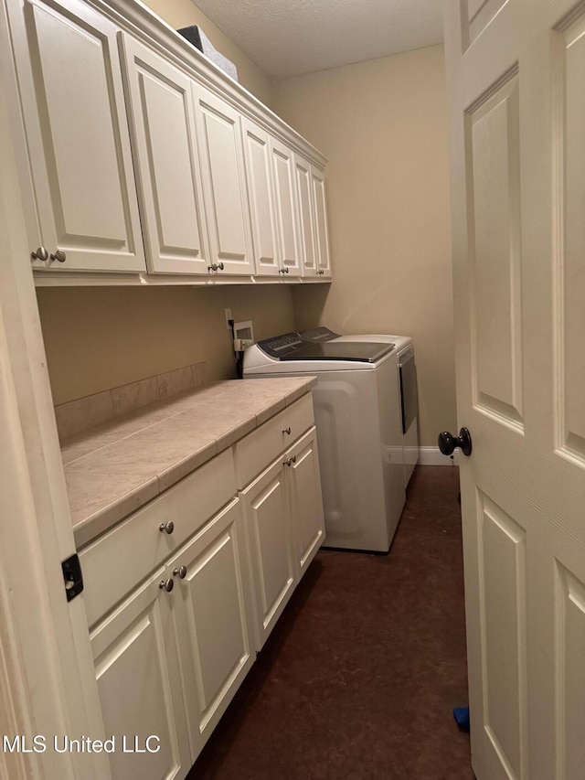 8 Audubon Pl, Natchez, MS 39120 - washroom with independent washer and dryer, cabinet space, and baseboards
