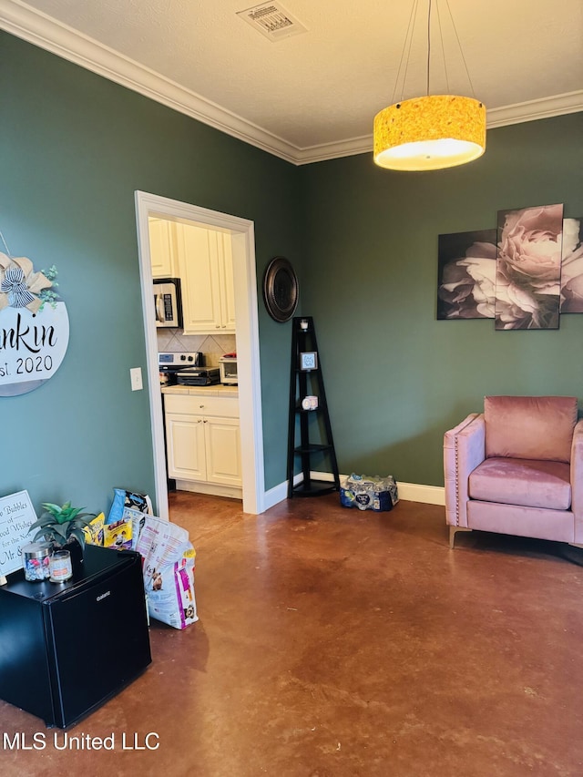 8 Audubon Pl, Natchez, MS 39120 - living area featuring baseboards, visible vents, finished concrete flooring, and crown molding