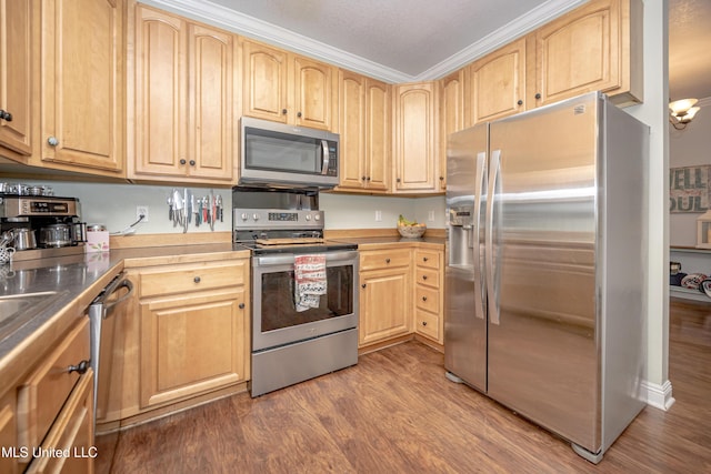 13109 Little Bluff Dr, Vancleave, MS 39565 - kitchen with appliances with stainless steel finishes, light brown cabinets, dark wood-style flooring, and ornamental molding