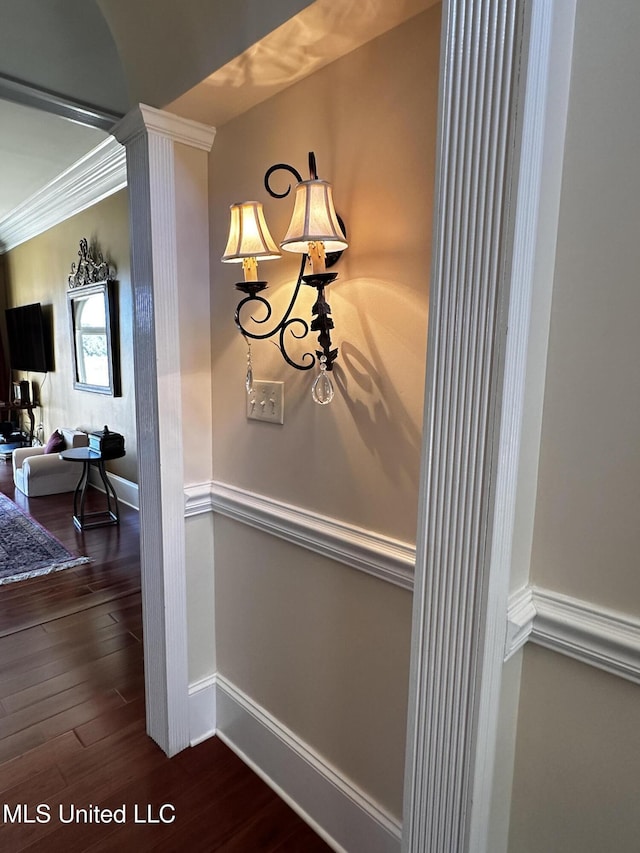 interior details with wood-type flooring, ornamental molding, and ornate columns