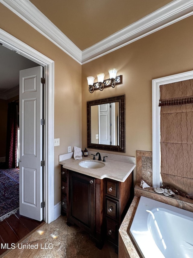 bathroom featuring vanity, a relaxing tiled tub, and ornamental molding