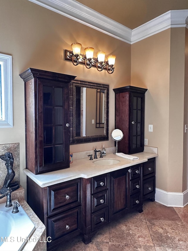 bathroom with ornamental molding, vanity, and a washtub