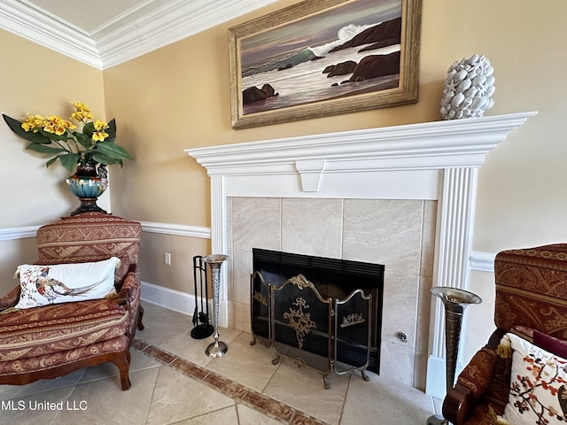 sitting room featuring crown molding and a fireplace