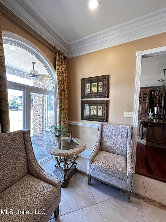 sitting room featuring ornamental molding