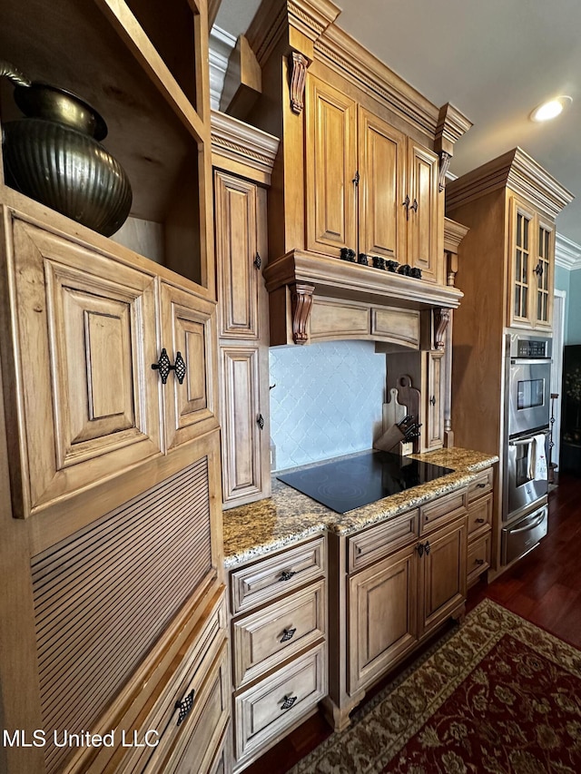 kitchen featuring black electric cooktop, dark hardwood / wood-style floors, custom range hood, stainless steel double oven, and backsplash