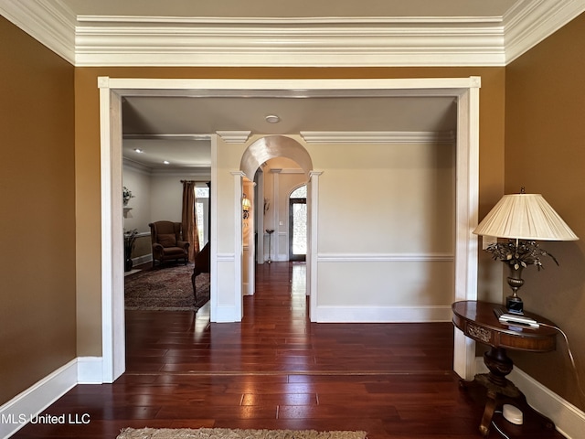 hall featuring dark hardwood / wood-style flooring and ornamental molding