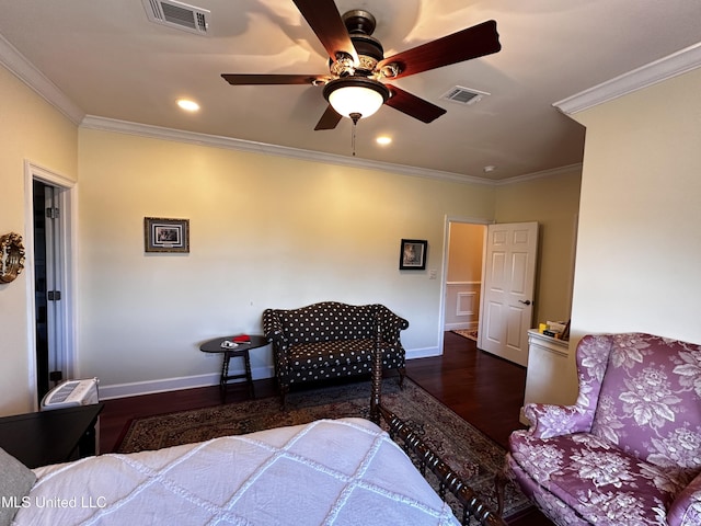 bedroom featuring dark hardwood / wood-style flooring, ornamental molding, and ceiling fan